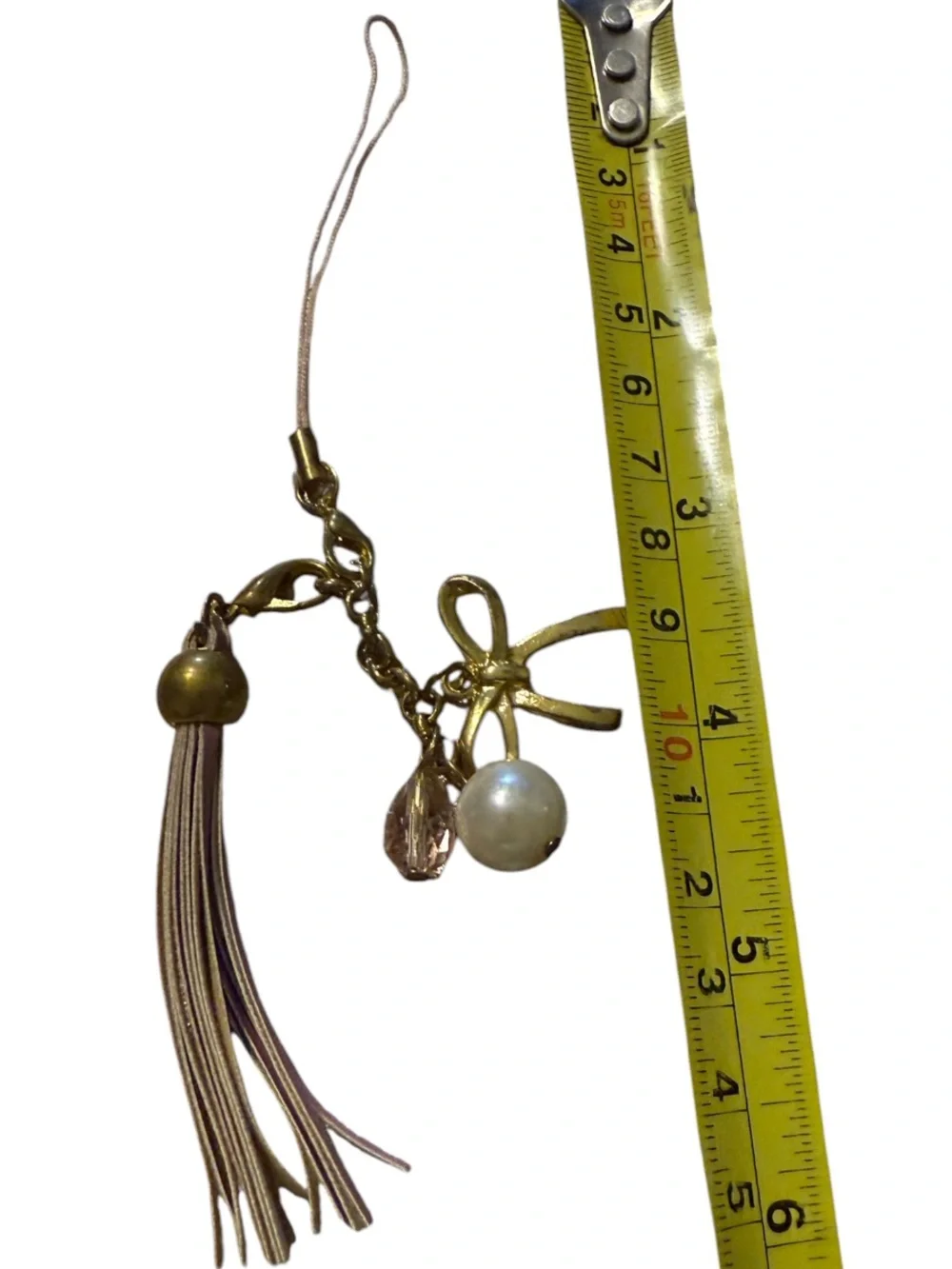 BENEIGE handmade bow and pearl bag charm featuring a gold-toned bow accent